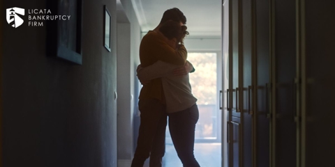 Couple embracing in their home